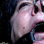 Third pic of SexPreviews - Fem Car busty submissive brunette bound in metal in water tank and toyed to orgasms