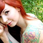 Second pic of Bosomy cutie Ivy Jean is exposing her nude tattooed body in the open air