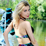 First pic of Eva Tali wriggles out of her bikini and climbs aboard a boat