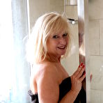 Fourth pic of Naughty British mature lady getting wet in bed
