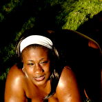 Second pic of Total plumper ebony exposes her big heavy hooters outdoors