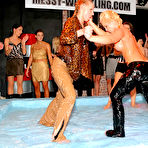 Third pic of Clothed wrestlers Sharka Blue and Sarah Zafari getting oil drenched as they wrestle in oil
