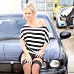 First pic of Frisky blonde Carla Cox flashes by the car in her black stockings and high heels