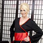 First pic of British blonde milf Ashleigh McKenzie in black kimono, red corset and fishnets