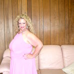First pic of Curly big breasted chubby woman Serena Sutherland strips out of her pink dress