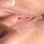Second pic of Plump blonde Ivy 36F gives a close-up of her shaved pink pussy before two men fuck her