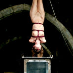 Third pic of Slim flexible slave girl Amber Rayne gets tied tight and showered in the dungeon