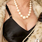 Second pic of Luxurious fem Lady Sonia wearing furry coat on the sexy black lingerie and pearls