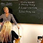 First pic of Donna Doll and another busty schoolgirl have fun with big strap-on dildo in front of their teacher