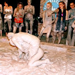 Third pic of Dionne Darling and Kia Winston get the mud wrestling started with their skirts and blouses on