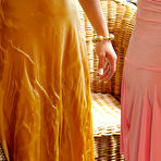 Second pic of Rachel Evans in golden dress and Hana Black in pink one pour wine on each others breasts