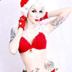 First pic of White haired goth model Razor Candi in red Christmas lingerie shows off her tits