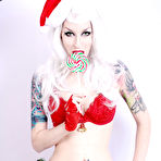 Fourth pic of White haired goth model Razor Candi in red Christmas lingerie shows off her tits