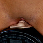 Second pic of Round titted tan skin slave Richelle Ryan rubs her smooth pussy on sybian