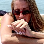 Third pic of Lori Anderson tweaks her long sun-faded arm hair on a yacht in the middle of the sea
