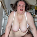 Fourth pic of Amateur chubby housewife getting nasty in the kitchen - GrannyPornPics.net