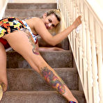 Second pic of Bad Dolly showing her panties and pussy on the stairs