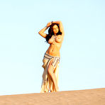 First pic of Stunning diva Aria Giovanni sensually poses in the desert with her enormous boobs