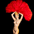 First pic of Miss Miranda poses in a burlesque costume and feather fans