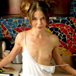 First pic of Cute little girl Nedda poses naked in the kitchen with a teasing smile on her face