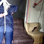 Fourth pic of Shinynylonartsbound | Sandra tied and gagged overhead with ropes and a ballgag overhead prepared to be hunged up by Stella both wearing sexy shiny nylon rainwear (Video) 