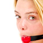 Second pic of GagGirls.com | GG02 - Eva in red ball gag and handcuffs