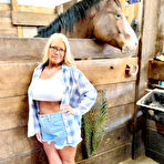First pic of Blonde amateur Maddie Cross reveals her large boobs while going au naturel in a horse stall | NakedWomenPhotos.net