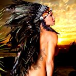 First pic of Tatted transgirl Danni Daniels models an indigenous headdress while naked in heels | TRANS.pics