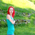 Fourth pic of Slim redhead chick posing in a shirt and skirt outdoors 15 photos