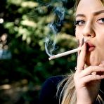 First pic of Russian Smokers | Blond lady is smoking white cigarette outdoors