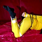 Third pic of ShinyNylonArts Rain Bound | Get 2 Videos with Lucy bound and gagged enjoying her shiny nylon Rainwear from our 2021 Archive