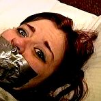 Fourth pic of tied-and-gagged.com | 23 YR OLD REAL ESTATE BROKER IS MOUTH STUFFED WITH A SPONGE, WRAP TAPE GAGGED, GAG TALKING, RAG STUFFED IN MOUTH AND TIGHTLY HANDGAGGED  (D74-15)