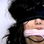 Second pic of tied-and-gagged.com | 35 YEAR OLD ITALIAN HAIRDRESSER IS CLEAVE GAGGED, MOUTH STUFFED WITH PANTIES, GAG TALKING, BLINDFOLDED WHILE TIGHTLY TIED TO A CHAIR (D74-8)