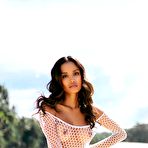 Second pic of Putri Cinta drops her white fishnet dress at the beach showcasing big boobs