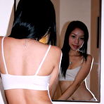 Second pic of 19 years old Asian girl flashing her small titties and her tight pussy