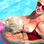 Second pic of Older blonde fatty Melody engages in lesbian play in a swimming pool