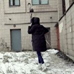 Fourth pic of White girl Vika takes an urgent piss on snow-covered ground next to a building