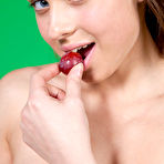 Fourth pic of Sweet teen Pamela D holds a bunch of grapes while posing in the nude