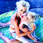 Fourth pic of Lesbian pornstars Angie & Puma Swede kiss while clothed in a wading pool