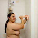 Third pic of Amateur BBW Kimberly Scott sucks a suction dildo while taking a shower