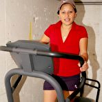 First pic of Latina chick uncovers her big boobs while exercising on a machine