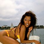 First pic of Mixed-race beauty Kitchie Laurico takes off her bikini top while on a boat