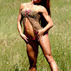 First pic of Bodybuilder with long red hair Tammi Bingham models lingerie in a field