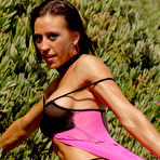 Second pic of Bodybuilder Tina Locklear poses on a hillside for a non-nude shoot