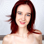 Second pic of Thin redhead Kira Cute highlights her hairless teen pussy after getting naked