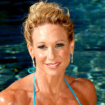 First pic of Hot MILF Dena Anne releases her enhanced tits from a bikini while in the water