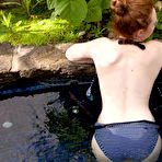 Second pic of Pale redhead Misha Lowe shows her big naturals and bare ass in hot tub