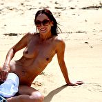 Third pic of Sexy MILF Roxeanne poses for a nude shoot while at the beach