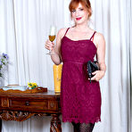First pic of Hot redhead housewife Amber Dawn drains her wineglass before modeling naked