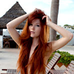 First pic of Redheaded teen girl Mia Sollis poses naked on a poolside deck chair